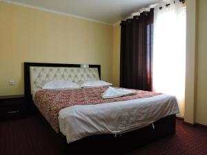 Кровать или кровати в номере Inn Kochevnik