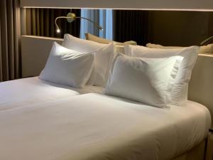 Кровать или кровати в номере Hotel Cristal Setúbal