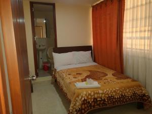 Postel nebo postele na pokoji v ubytování Hotel Suyusama + 30 fotografií