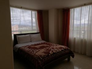 Postel nebo postele na pokoji v ubytování Hotel Suyusama