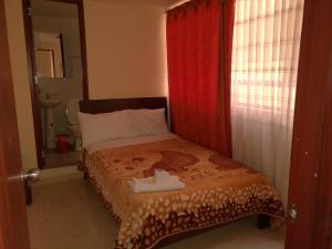 Postel nebo postele na pokoji v ubytování Hotel Suyusama