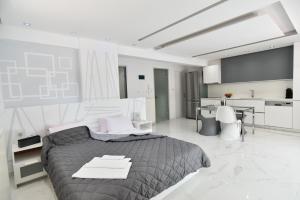 Ένα ή περισσότερα κρεβάτια σε δωμάτιο στο Alpha Delta Pool Suite