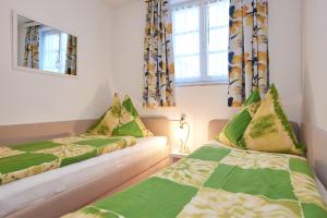 Postel nebo postele na pokoji v ubytování Apartments Geistlinger