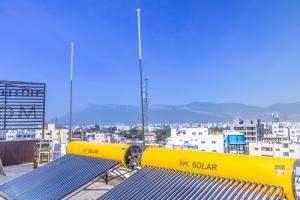 a pair of benches on top of a building at Hotel Mount View Comforts in Tirupati