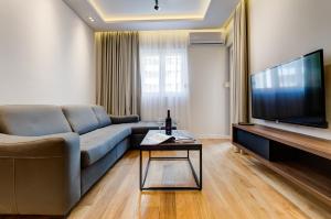 TV in/ali zabaviščno središče v nastanitvi Apart Compliment
