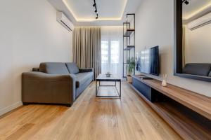 TV in/ali zabaviščno središče v nastanitvi Apart Compliment