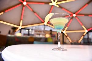 a martini glass with a lime on a table at Garden Inn Resort Sevan in Sevan