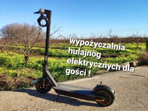 a scooter parked on the side of a road at Apartamenty Willa Ada in Jastarnia