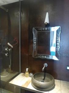 a bathroom with a sink and a mirror at Appartement Résidence Astoria in Chamonix