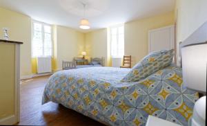 Ένα ή περισσότερα κρεβάτια σε δωμάτιο στο Le Guitou