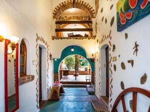 a hallway in a house with a painting on the wall at Casa Miguel Arcangel in Coatepec