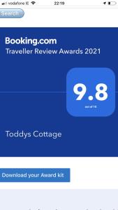 a screenshot of a phone with a travel review app at Toddys Cottage & Stables in Cavan