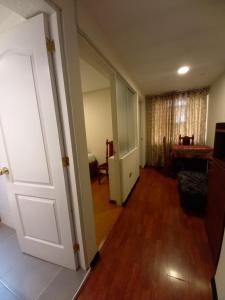 an empty hallway with a door and a room at Golden Inca Hotel in Cusco