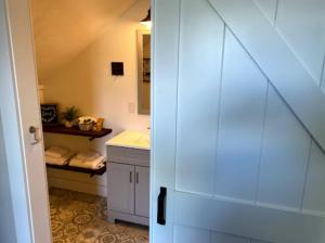 a bathroom with a sink and a shower stall at The Farmhouse Inn & Kitchen, 2 blocks from Downtown Whitefish, Montana in Whitefish