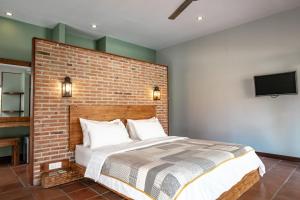 מיטה או מיטות בחדר ב-Belukar Villas