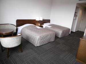Ліжко або ліжка в номері アーバンホテル二本松