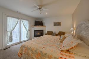 a bedroom with a bed and a fireplace at 2310 Central Avenue in North Wildwood