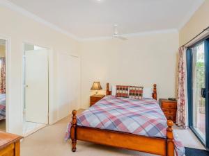 a bedroom with a bed and a window at Lateeze in Yamba
