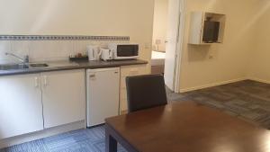 Kuchyň nebo kuchyňský kout v ubytování Hotel Cavalier