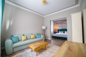 Ένα ή περισσότερα κρεβάτια σε δωμάτιο στο Garrison's Suites