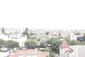 vista su una città con case e alberi di Homey 2BR Majesty Apartment near Maranatha University By Travelio a Bandung