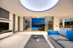 a living room with a couch and a table at Villa Ahiska in Kalkan