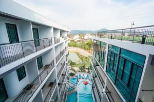 an overhead view of a building with a swimming pool at Poolrada Boutique Hotel - SHA Plus in Thalang