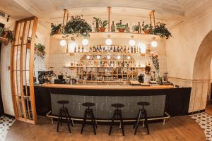 a bar with stools in front of a counter at Hotel 52 in Odesa