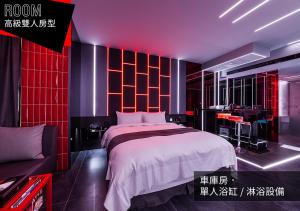 a bedroom with a bed and a desk in it at If Motel In Fashion in Taoyuan