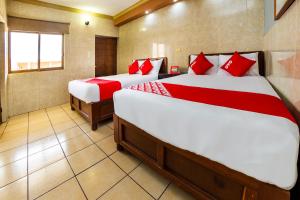 Postel nebo postele na pokoji v ubytování Hotel Romo