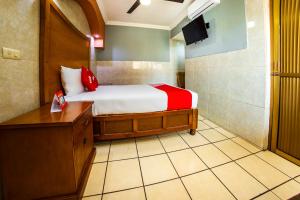 Postel nebo postele na pokoji v ubytování Hotel Romo