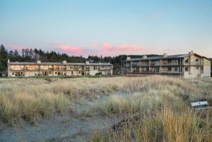 a large building in the middle of a field at Hi-Tide Resort in Moclips