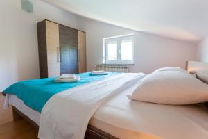 Postel nebo postele na pokoji v ubytování Apartments L&S