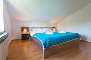 Postel nebo postele na pokoji v ubytování Apartments L&S