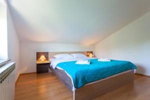 Postel nebo postele na pokoji v ubytování Apartments L&S