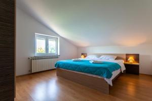 Postel nebo postele na pokoji v ubytování Apartments L&S