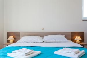 Postel nebo postele na pokoji v ubytování Apartments L&S