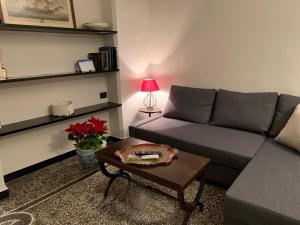 a living room with a couch and a table at Il Genovino in Genoa