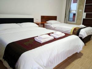 En eller flere senger på et rom på Jeerang Countryside Resort