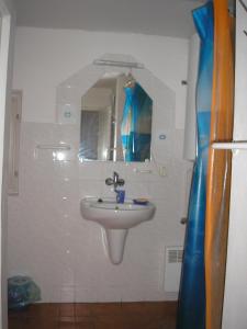 a bathroom with a sink and a mirror at Privat Libuša in Liptovský Hrádok