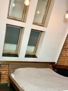 Posteľ alebo postele v izbe v ubytovaní Apartamenty Młyńska 4