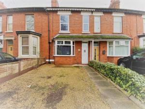 a brick house with a driveway in front of it at Ruskin Place by SG Property Group in Crewe