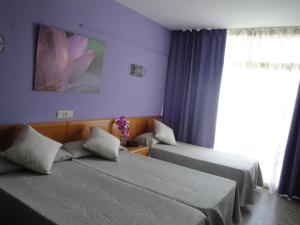 Posteľ alebo postele v izbe v ubytovaní Hotel Esplendid