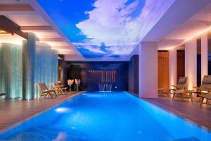 a swimming pool in a hotel with a sky ceiling at Time Boutique Hotel in Split