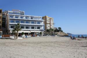 a hotel on the beach next to the ocean at Hotel La Cala Finestrat in Cala de Finestrat