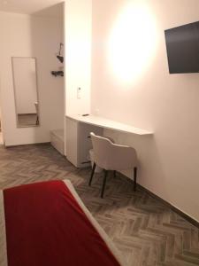 Televízia a/alebo spoločenská miestnosť v ubytovaní Frattina FF italian suites