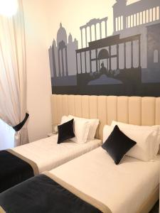 Posteľ alebo postele v izbe v ubytovaní Frattina FF italian suites