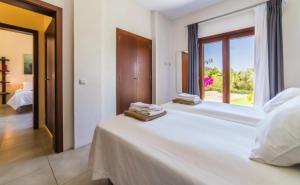 Posteľ alebo postele v izbe v ubytovaní Villa Son Sard