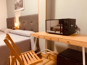 Postel nebo postele na pokoji v ubytování Hostal Patria Madrid