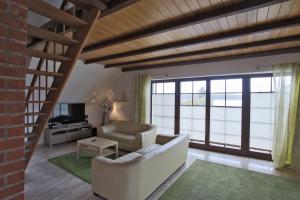 Posezení v ubytování Hotel & Restaurant Am Wasser